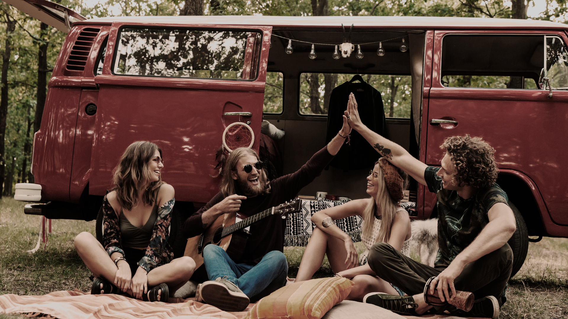 Black and white photo of a women performing modern dance on a dark background.